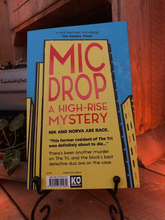 Load image into Gallery viewer, Image shows the back cover of the paperback book Mic Drop written by Sharna Jackson and part of the High Rise Mystery series.