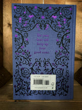 Load image into Gallery viewer, Image of the back cover of the Puffin clothbound classic Black Beauty with a purple background and a print of black rose thorns with purple foiled roses and buds in a mirrored pattern. In the centre is a purple foil print of a quote from the story - &#39;Do your best and keep up your good name.&#39;