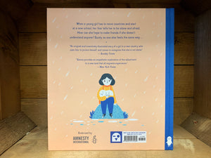 Image shows the back cover of the hardback book Me and My Fear  with a beige background and blue text blurb with a sound, stylized illustration of a girl and hear fear shown as a white round character in her lap.