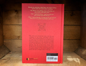 Image of the back cover of Beauty and the Beast with gold foil embossed text excerpt and rose, with blurb below in black text.