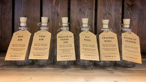Image shows the full range of Airs and Graces bottles. From left to right: Hot Air, Thin Air, Breath of Fresh Air, Ill Wind, Trapped Wind, and Winds of Change.