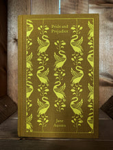 Load image into Gallery viewer, Image of the front cover of the Penguin clothbound classic book Pride &amp; Prejudice featuring a yellow ochre background with a yellow printed repeat pattern of standing swans and leafy stems.