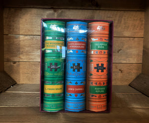 Image of the Jigsaw Library Book Trilogy, featuring three children's classic book puzzles including The Wonderful Wizard of Oz, Alice's Adventures in Wonderland and The Jungle Book.