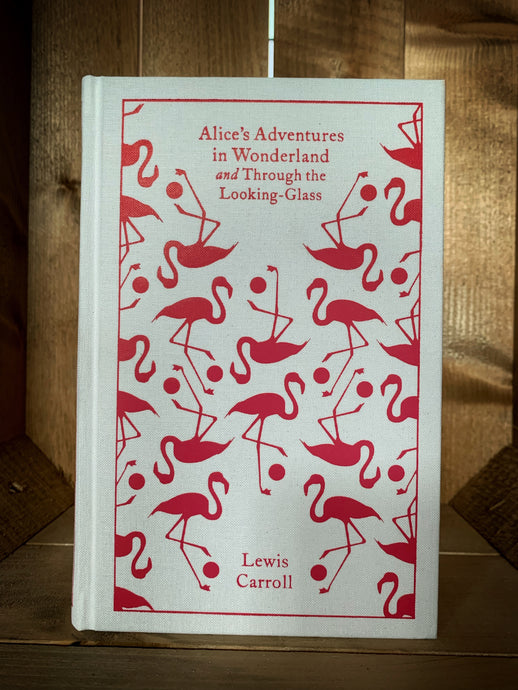 Image showing the front cover of the clothbound classic Alice's Adventures in Wonderland and Through the Looking-Glass. Cover is white with a bright pink repeat print of flamingos and croquet balls.
