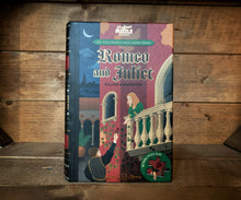 Load image into Gallery viewer, Image shows the book-shaped Jigsaw Library Romeo &amp; Juliet with the front cover depicting Juliet on her balcony in Verona and Romeo reaching up to offer a rose.