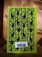 Load image into Gallery viewer, Image showing the back cover of the Penguin clothbound classic The Jungle Books featuring a lime green background with a repeat printed pattern of navy blue capuchin monkeys hanging from vines or each other. 