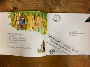 Image of a review page of The Jolly Postman showing an illustration of a gingerbread house and the postman with the Wicked Witch, next page is the envelope for her letter.