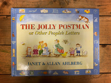 Load image into Gallery viewer, Image of the front cover of hardback book The Jolly Postman or Other People&#39;s Letters with an illustration showing many well-known fairy tale characters reading letters on a pale yellow background surrounded by a blue border.