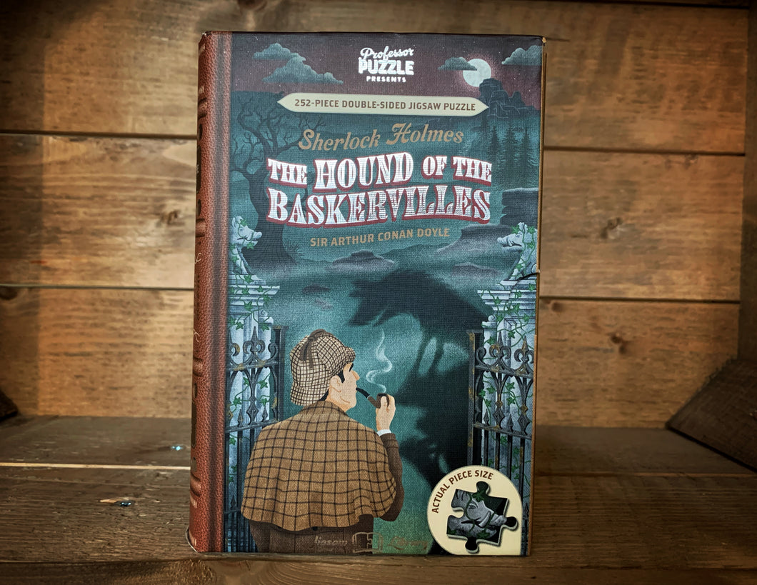 Image showing thebook-shaped Jigsaw Library The Hound of the Baskervilles with a front cover design of Sherlock Holmes with pipe in hand looking out onto the moors with the shadow of a dog looming ahead.