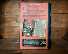 Load image into Gallery viewer, Image of the Jigsaw Library Pride &amp; Prejudice showing the back cover of the book-shaped box and the double-sided puzzle design with the image and an excerpt from the story.