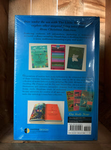 Image showing the back of The Little Mermaid and Other Fairy Tales edition by MinaLima, with a fly page showing the contents of the book. Images include graphic illustrations from the Princess and the Pea, The Ugly Duckling and The Little Mermaid. 