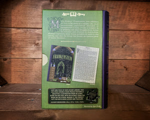 Image of the Jigsaw Library Frankenstein showing the back cover of the book-shaped box and the double-sided puzzle design with the image and an excerpt from the story.