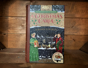 Image showing the jigsaw library featuring A Christmas Carol. Design features a wintry Victorian scene with Scrooge sat in his counting house.