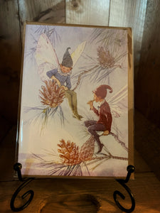 Image of greetings card Fairy Land with Pinecones, a full-colour watercolour style illustration of fairies with pinecones in a wintry scene