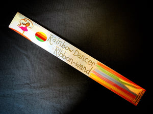 Image showing the outer packaging of the Flying Colours ribbon wand with an illustrated image of a dancing child on the box.
