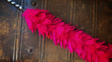 Load image into Gallery viewer, Image of a Brain Duster with bright pink feathers and black and white striped handle. 