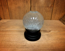 Load image into Gallery viewer, Image of the silver glitter globe after being shaken.