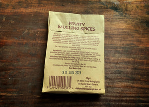 Image shows the back of a kraft paper pouch of Fruity Mulling Spices. The back has the ingredients and instructions for use.