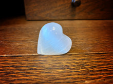Load image into Gallery viewer, Image shows a close up view of  the heart shaped Blue Moon Crystal (selenite crystal).