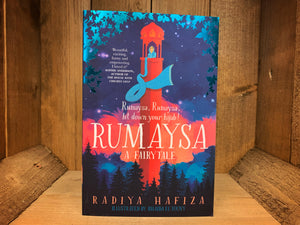 Image shows the front cover of the book Rumaysa: A Fairytale. The cover has an illustration of a tall tower rising over a forest, with a woman in blue coloured hijab at the top. The fabric of the hijab is hanging down the tower. The tower and part of the sky are bright orange, and the forest and surrounding sky are in shades of blue. 