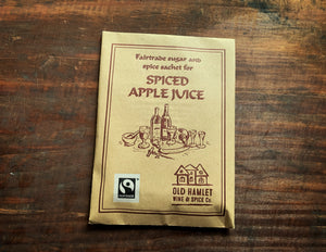 Image of the front of a kraft paper pouch of Spiced Apple Juice spices.