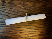 Load image into Gallery viewer, Image of the Scent Portal journey description rolled into a scroll and tied with baker&#39;s twine as supplied in each Scent Portal box.