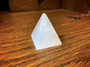 Image shows a close up view of  the pyramid shaped Blue Moon Crystal (selenite crystal).