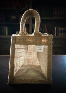 Image of a single window jute gift bag with jute handles,.