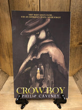 Load image into Gallery viewer, Image of the front cover of the paperback book Crow Boy, featuring a black background and an illustration of a plague doctor over the streets of historical Edinburgh.